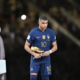 Kylian Mbappe holding the Golden Boot award